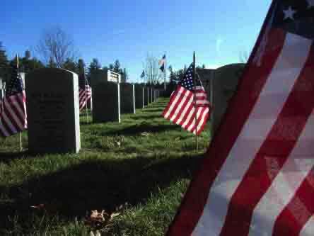 Austin tx funeral home military headstones with United States Flags and green grass f